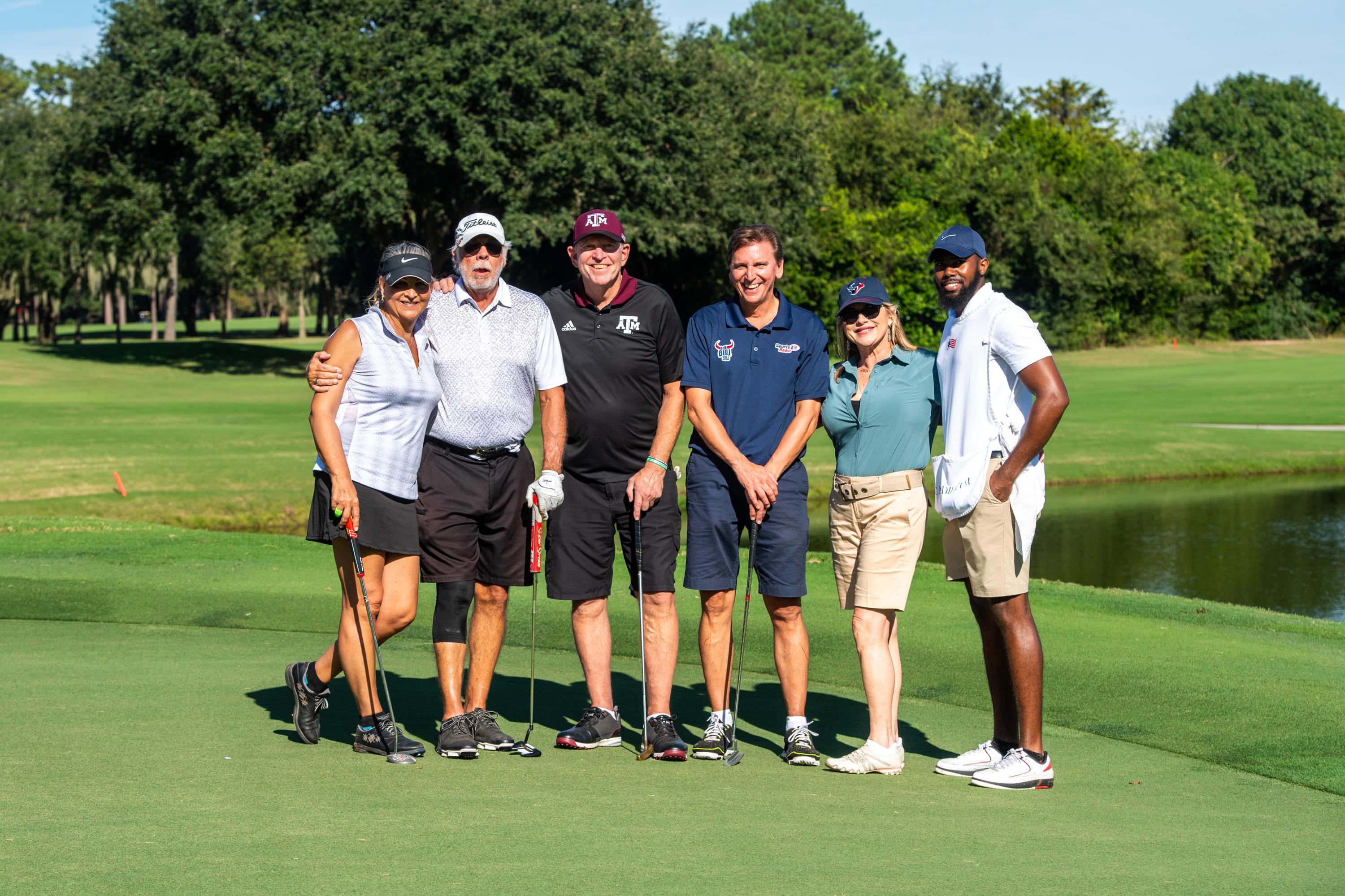 Group photo of people at the golf course